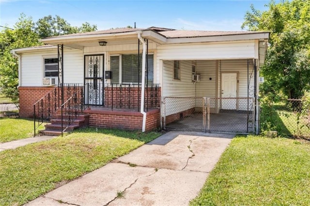 1101 Elmira St, Mobile, AL 36604 - bungalow-style house featuring driveway, a front lawn, a carport, and a porch
