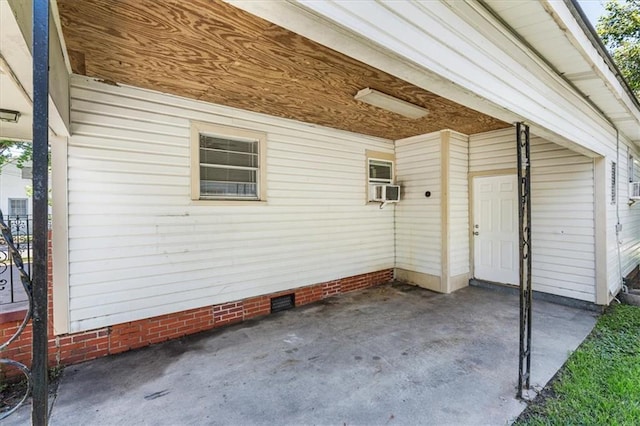 1101 Elmira St, Mobile, AL 36604 - doorway to property featuring a patio area, a carport, and crawl space