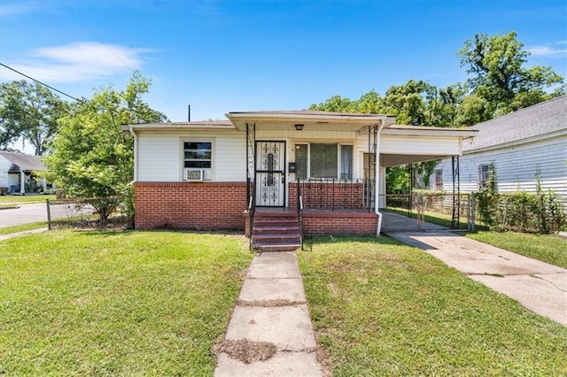 1101 Elmira St, Mobile, AL 36604 - bungalow-style house featuring concrete driveway, brick siding, and an attached carport