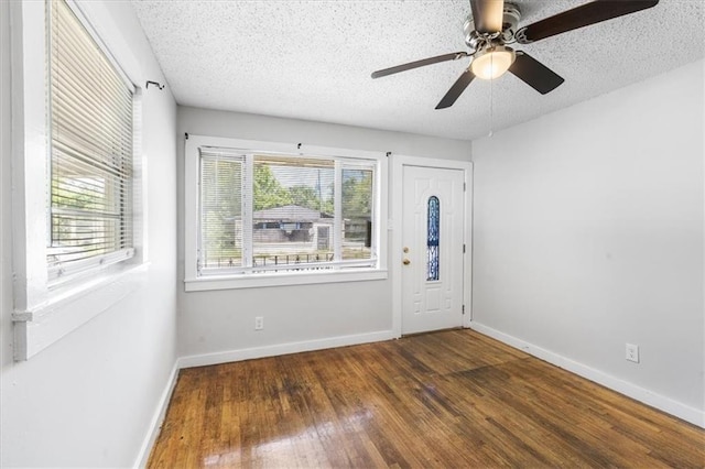 1101 Elmira St, Mobile, AL 36604 - foyer featuring wood finished floors, a textured ceiling, baseboards, and ceiling fan