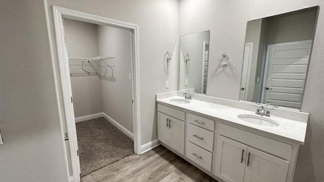 bathroom featuring hardwood / wood-style floors and vanity