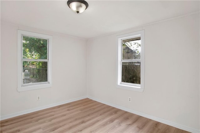 spare room featuring light wood-type flooring