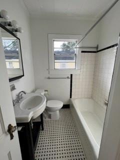 full bathroom featuring toilet, tiled shower / bath combo, ornamental molding, and vanity