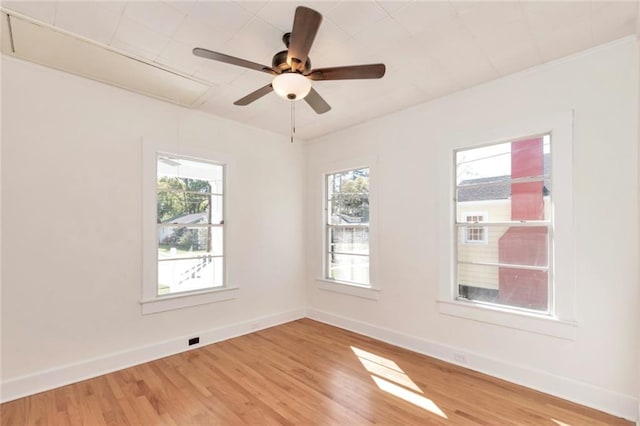 unfurnished room with ceiling fan and light hardwood / wood-style floors