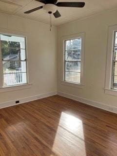 unfurnished room with hardwood / wood-style floors, ceiling fan, and a healthy amount of sunlight