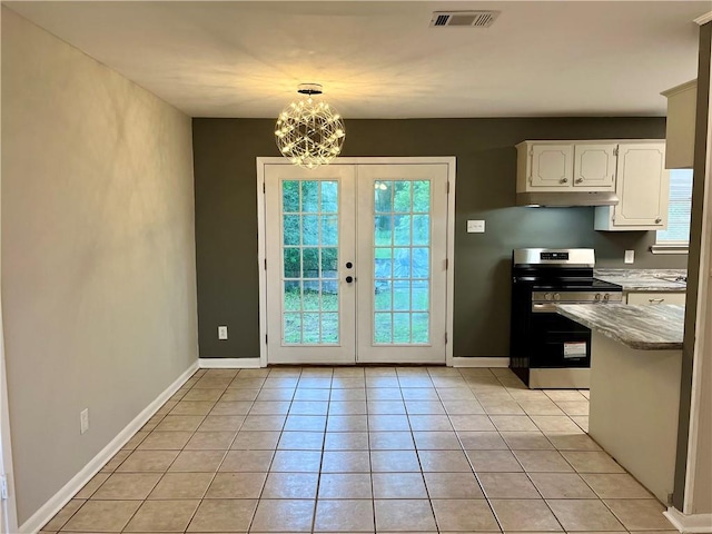 8636 Boe Rd, Irvington, AL 36544 - doorway with light tile patterned floors, baseboards, a chandelier, and french doors