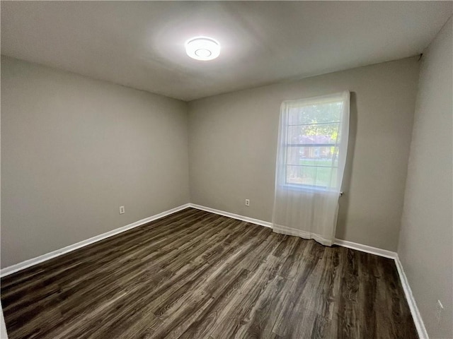 8636 Boe Rd, Irvington, AL 36544 - spare room with dark wood-style floors and baseboards
