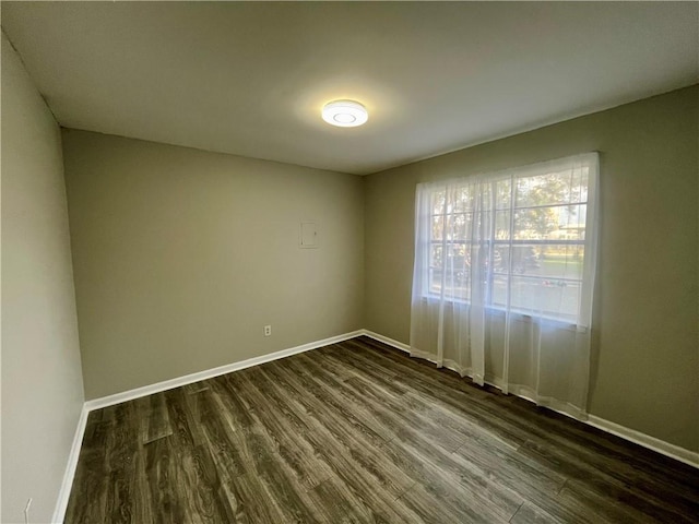 8636 Boe Rd, Irvington, AL 36544 - empty room with dark wood-style flooring and baseboards