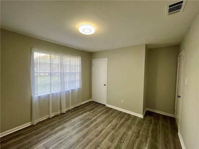 8636 Boe Rd, Irvington, AL 36544 - empty room with dark wood finished floors and baseboards