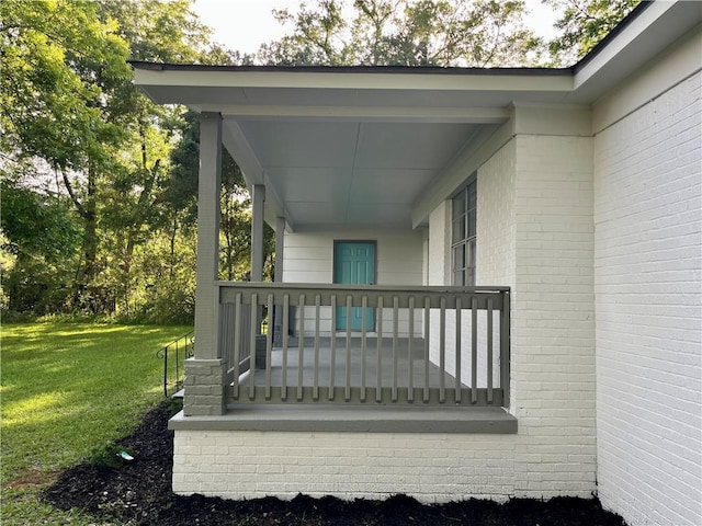 8636 Boe Rd, Irvington, AL 36544 - wooden porch featuring a lawn