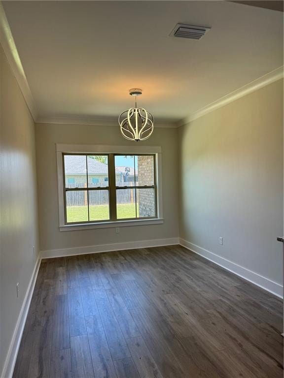 unfurnished room featuring dark hardwood / wood-style flooring, crown molding, and a chandelier