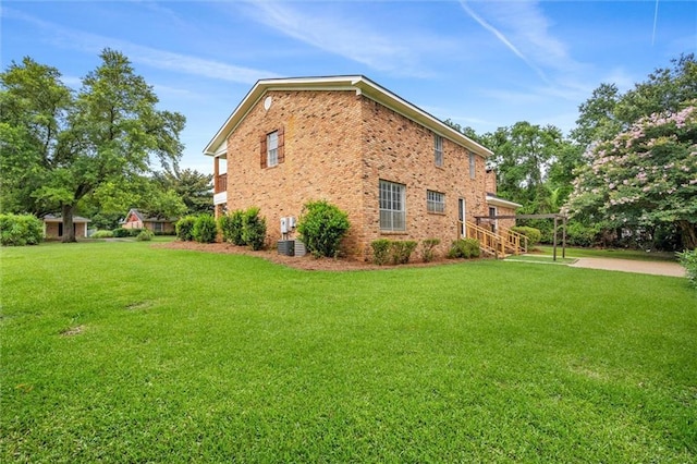 view of home's exterior with a yard