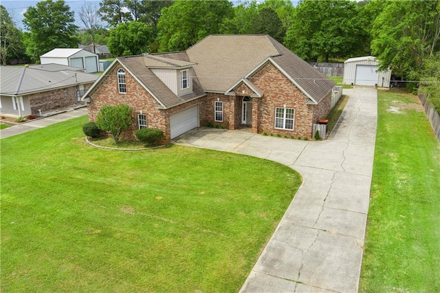 view of front of house with a garage and a front lawn