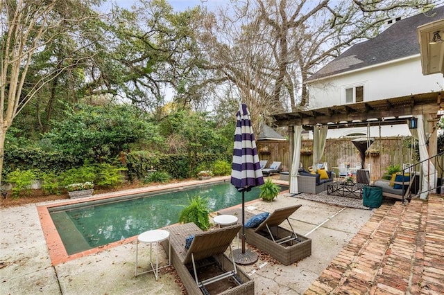 view of swimming pool featuring a patio and a pergola