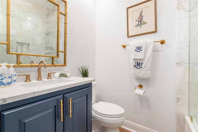 bathroom with toilet and vanity