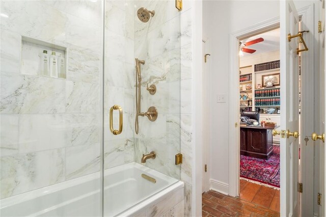 bathroom featuring ceiling fan, shower / bath combination with glass door, and hardwood / wood-style floors