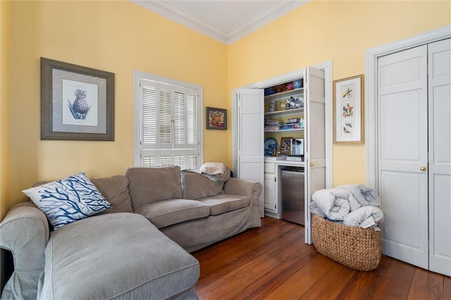 living room with crown molding and dark hardwood / wood-style floors