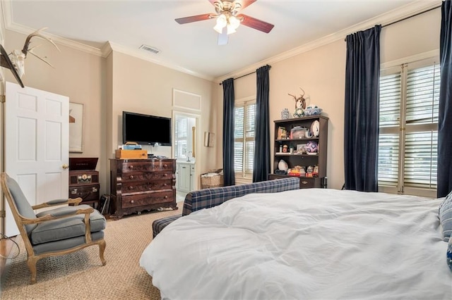 carpeted bedroom with crown molding and ceiling fan