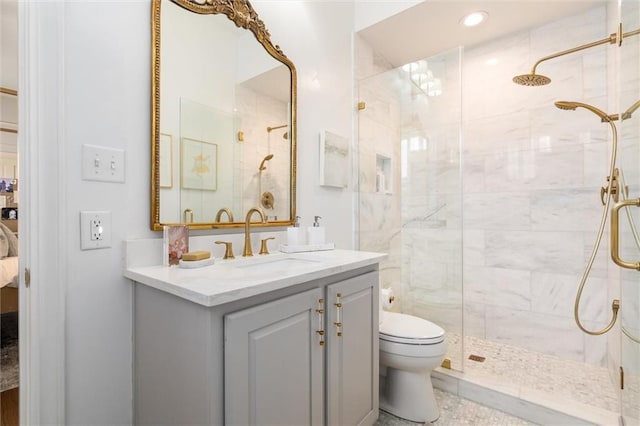 bathroom with vanity, an enclosed shower, tile patterned flooring, and toilet