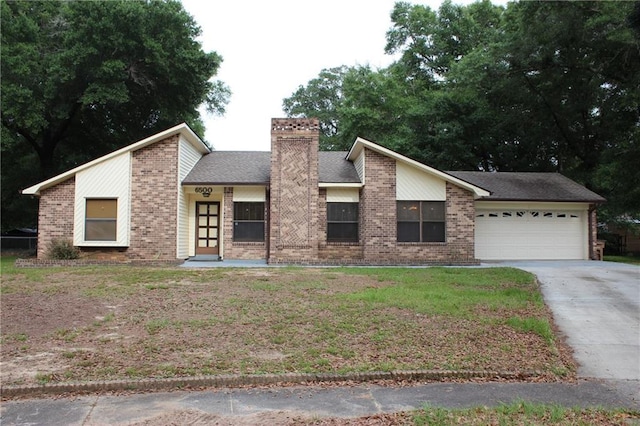 6500 Camden Cir, Mobile, AL 36618 - mid-century home featuring brick siding, a garage, driveway, and a chimney