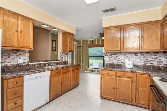 6500 Camden Cir, Mobile, AL 36618 - kitchen with dishwasher, brown cabinetry, and crown molding