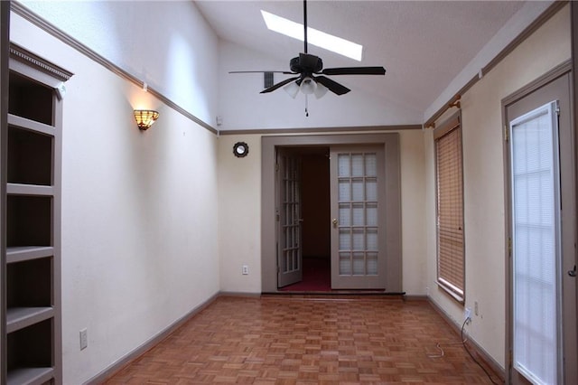6500 Camden Cir, Mobile, AL 36618 - unfurnished room featuring vaulted ceiling, a skylight, a ceiling fan, and baseboards