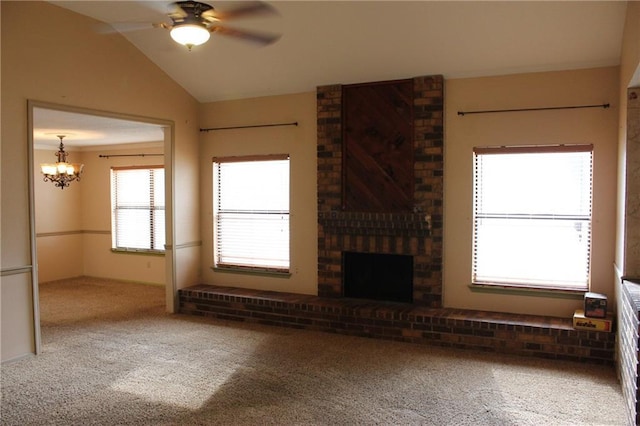6500 Camden Cir, Mobile, AL 36618 - unfurnished living room featuring carpet flooring, a chandelier, lofted ceiling, ceiling fan, and a fireplace