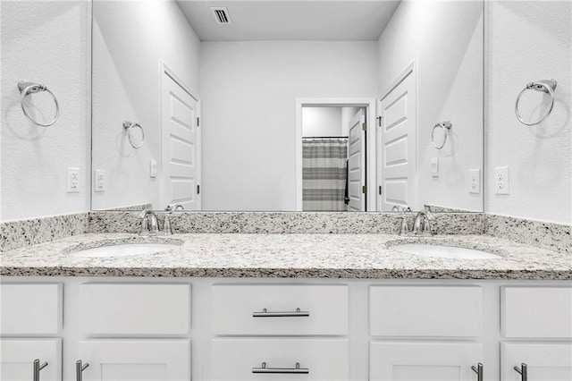 full bath featuring double vanity