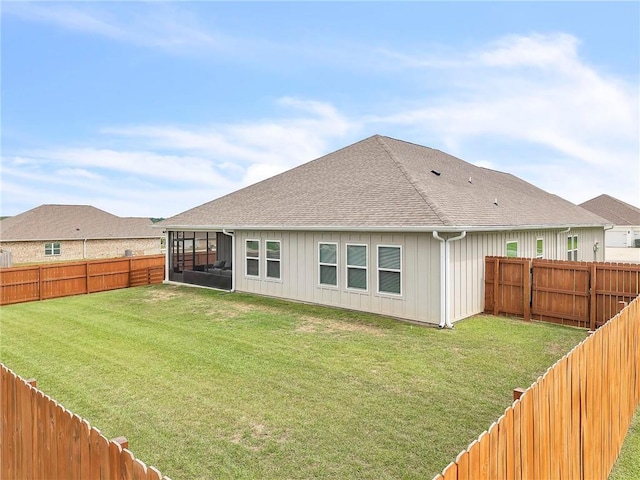 back of property with a sunroom, board and batten siding, and roof with shingles