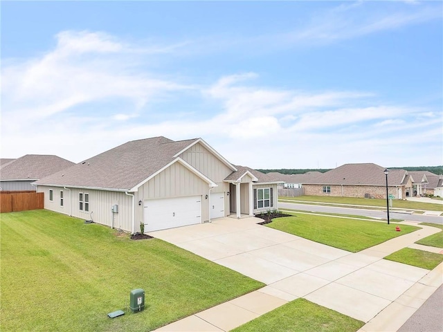 ranch-style house with an attached garage, driveway, roof with shingles, and board and batten siding