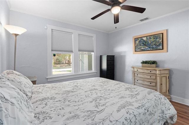 1704 Laurel St, Mobile, AL 36604 - bedroom with crown molding, dark wood-type flooring, and a ceiling fan
