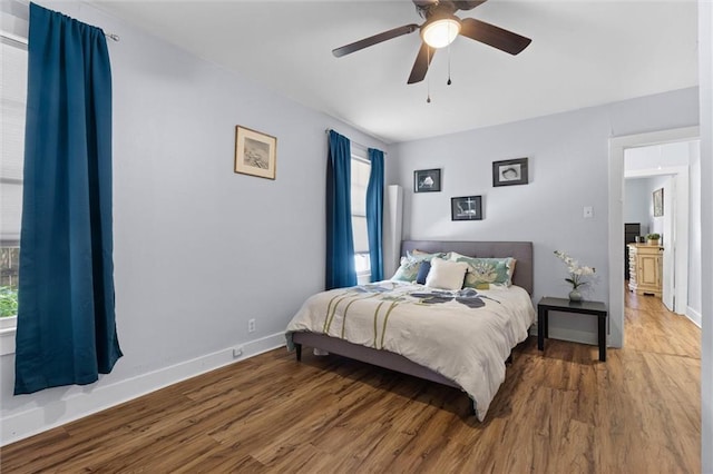 1704 Laurel St, Mobile, AL 36604 - bedroom featuring wood finished floors, multiple windows, and ceiling fan