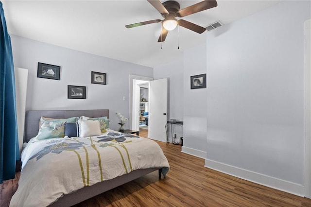 1704 Laurel St, Mobile, AL 36604 - bedroom with wood finished floors and a ceiling fan