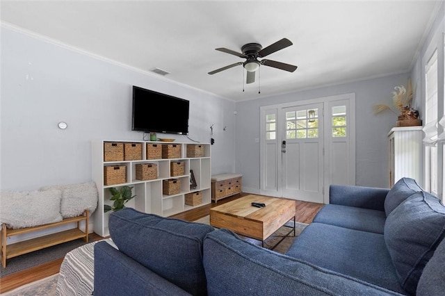 1704 Laurel St, Mobile, AL 36604 - living room with wood finished floors, ceiling fan, and ornamental molding