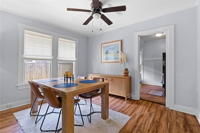 1704 Laurel St, Mobile, AL 36604 - dining area with light wood-style flooring, a ceiling fan, and ornamental molding