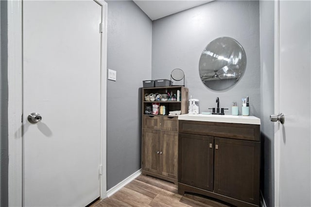 2017 Knollwood Dr, Mobile, AL 36609 - bathroom with wood finished floors, vanity, and baseboards