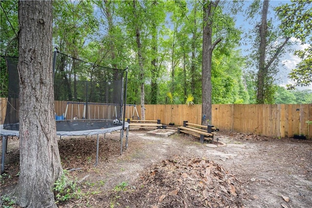 2017 Knollwood Dr, Mobile, AL 36609 - fenced backyard with a trampoline