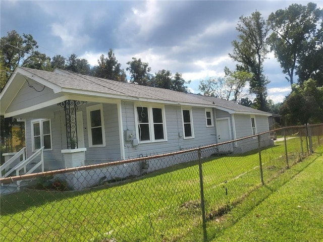 view of property exterior with a lawn