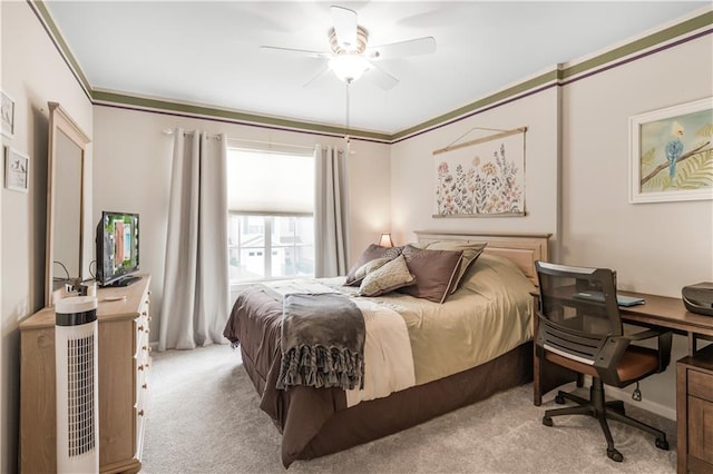 bedroom with ornamental molding, ceiling fan, and light colored carpet