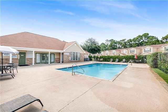 view of swimming pool with a patio area