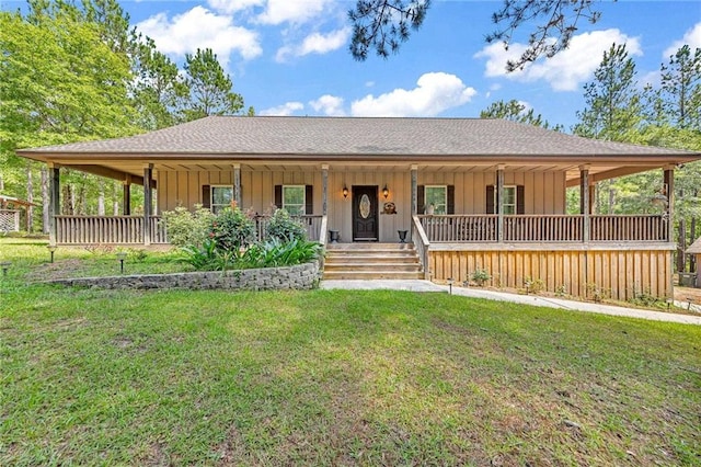 view of front of home with a front yard and a porch