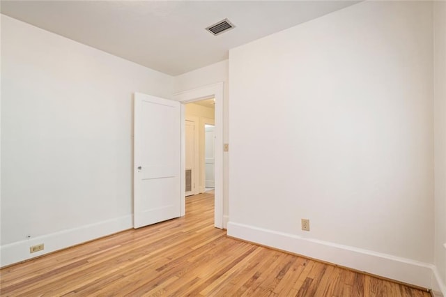 empty room with light hardwood / wood-style floors