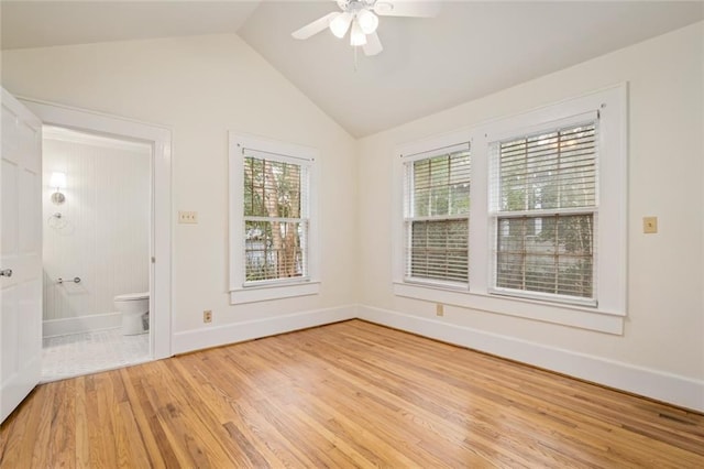 unfurnished room with ceiling fan, lofted ceiling, and light hardwood / wood-style flooring