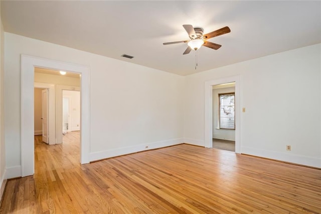 spare room featuring light hardwood / wood-style floors and ceiling fan