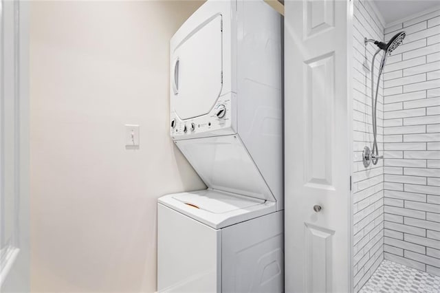 washroom with stacked washer and clothes dryer