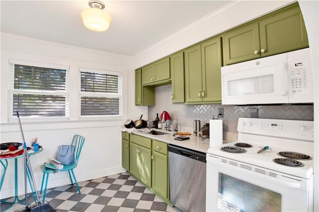 kitchen featuring tasteful backsplash, sink, ornamental molding, green cabinetry, and white appliances