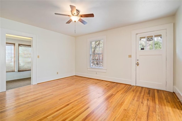 foyer with ceiling fan and light hardwood / wood-style flooring