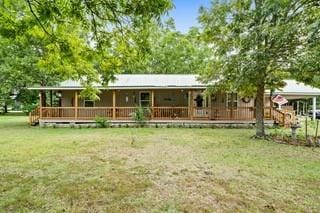 view of front of property with a front lawn and a porch