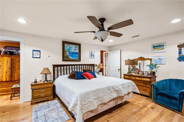 bedroom with light wood-type flooring and ceiling fan