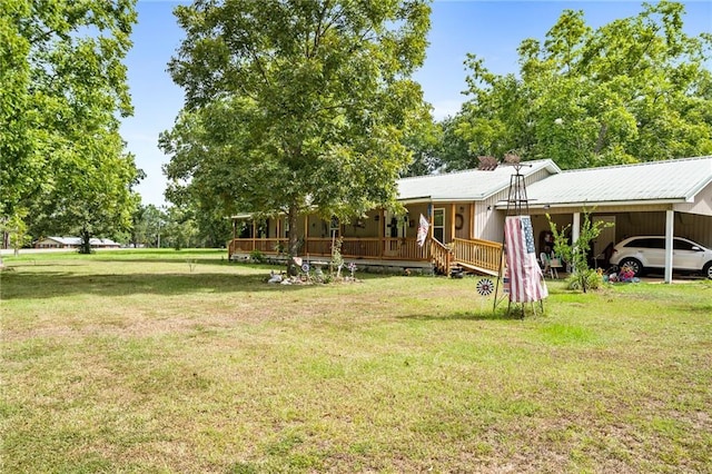 view of yard featuring covered porch